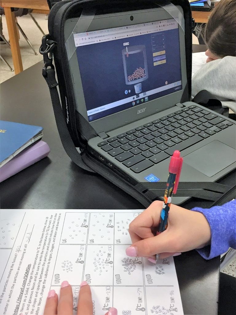 student using virtual PhET lab on states of matter and energy of particles