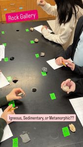 Students observing igneous, sedimentary, and metamorphic rocks.